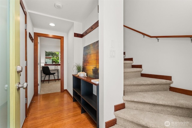 672 NE 40th St, Seattle, WA 98105 - stairs featuring wood finished floors, baseboards, and recessed lighting