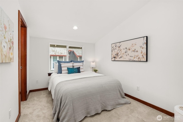 672 NE 40th St, Seattle, WA 98105 - carpeted bedroom featuring baseboards and vaulted ceiling