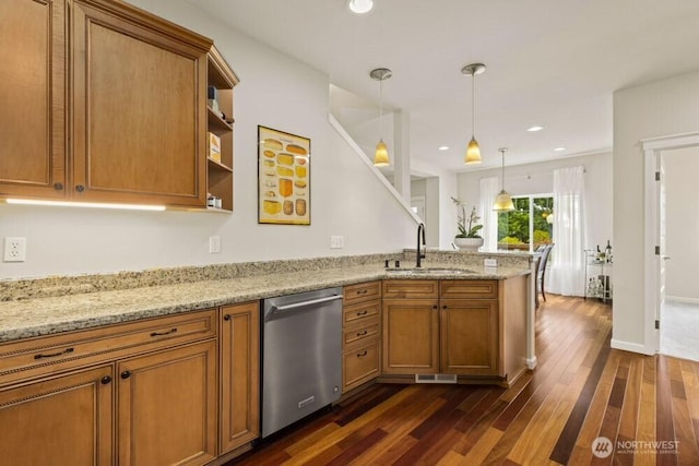 3707 Simmons Heights Ln SW, Tumwater, WA 98512 - kitchen with stainless steel dishwasher, a sink, a peninsula, brown cabinetry, and dark wood-style flooring