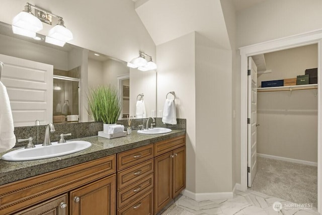 3707 Simmons Heights Ln SW, Tumwater, WA 98512 - full bathroom featuring double vanity, a shower stall, a spacious closet, baseboards, and marble finish floors