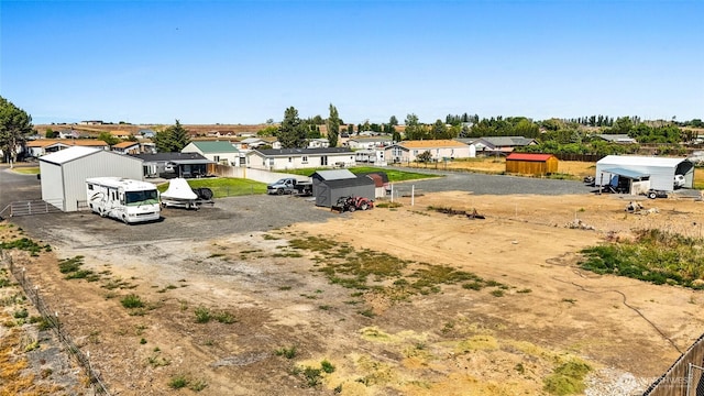 3327 Firouzi Dr NE, Moses Lake, WA 98837 - view of yard with a residential view and an outbuilding