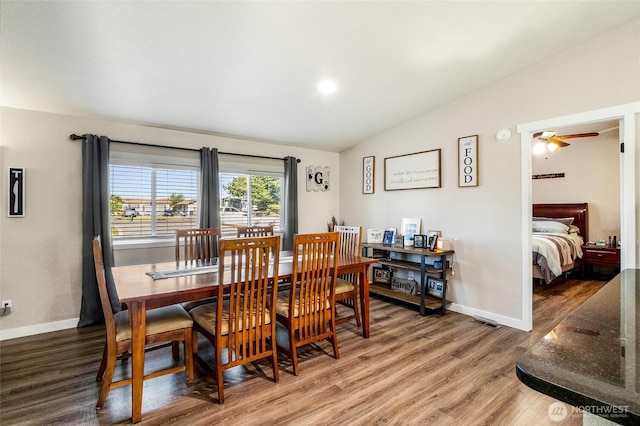 3327 Firouzi Dr NE, Moses Lake, WA 98837 - dining area featuring lofted ceiling, wood finished floors, baseboards, and a ceiling fan