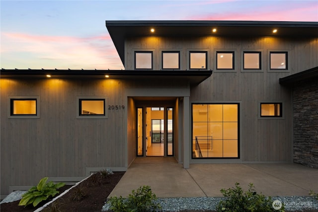 20519 Benson Ridge Ln, Mount Vernon, WA 98274 - back of property at dusk with a patio area