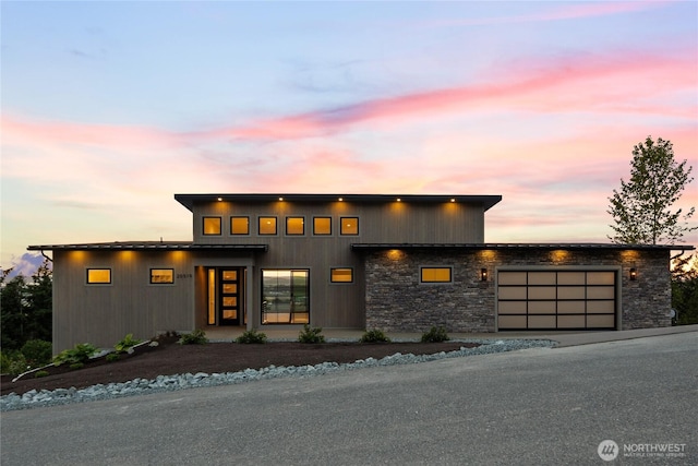 20519 Benson Ridge Ln, Mount Vernon, WA 98274 - contemporary house with an attached garage, stone siding, and asphalt driveway