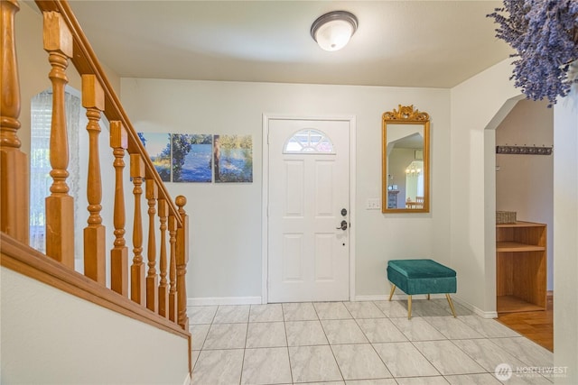 1160 Cays Rd, Sequim, WA 98382 - entryway with stairs, arched walkways, and baseboards