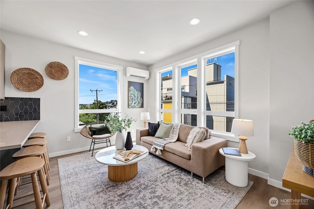 2817 Franklin Ave E Unit A, Seattle, WA 98102 - living area with a wall mounted air conditioner, wood finished floors, baseboards, and recessed lighting