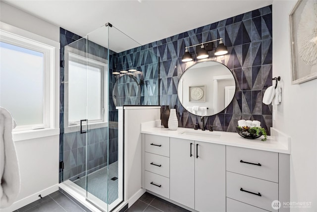 2817 Franklin Ave E Unit A, Seattle, WA 98102 - bathroom with tile patterned flooring, a shower stall, vanity, healthy amount of natural light, and tile walls