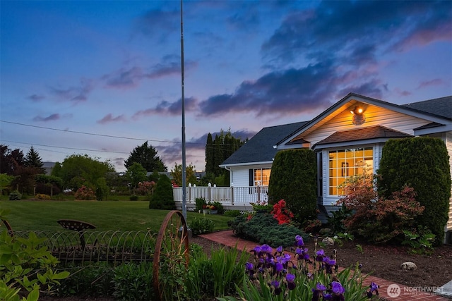 10918 159th Ave SE, Snohomish, WA 98290 - view of side of home with a yard and a shingled roof