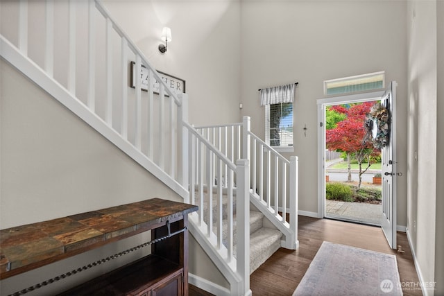 4415 Goldcrest Dr NW, Olympia, WA 98502 - entrance foyer featuring baseboards, wood finished floors, a high ceiling, and stairs