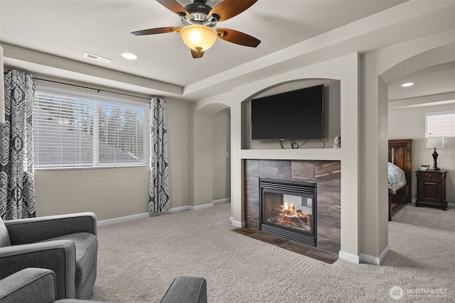 4415 Goldcrest Dr NW, Olympia, WA 98502 - living room featuring carpet floors, a tile fireplace, baseboards, a ceiling fan, and recessed lighting