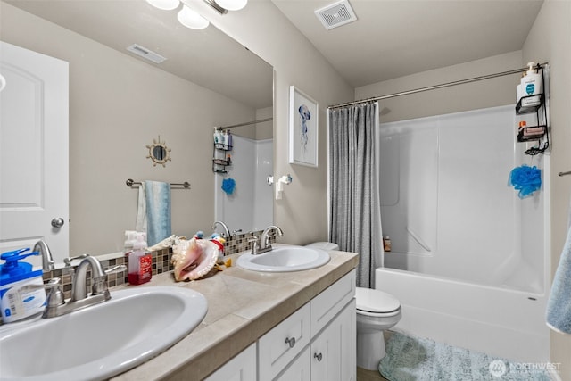 4415 Goldcrest Dr NW, Olympia, WA 98502 - full bathroom with double vanity, toilet, and shower / tub combo with curtain