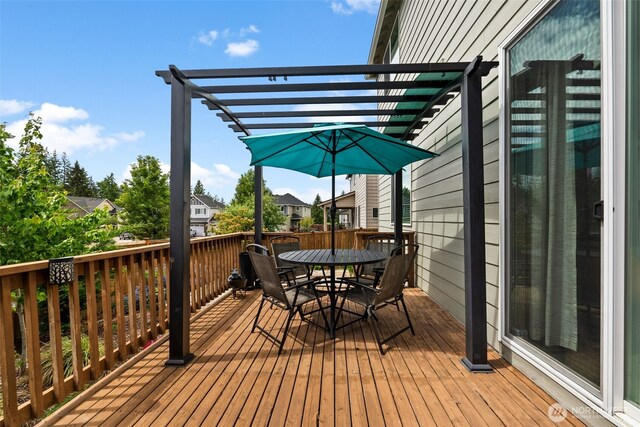 4415 Goldcrest Dr NW, Olympia, WA 98502 - wooden deck with outdoor dining area, a pergola, and a residential view