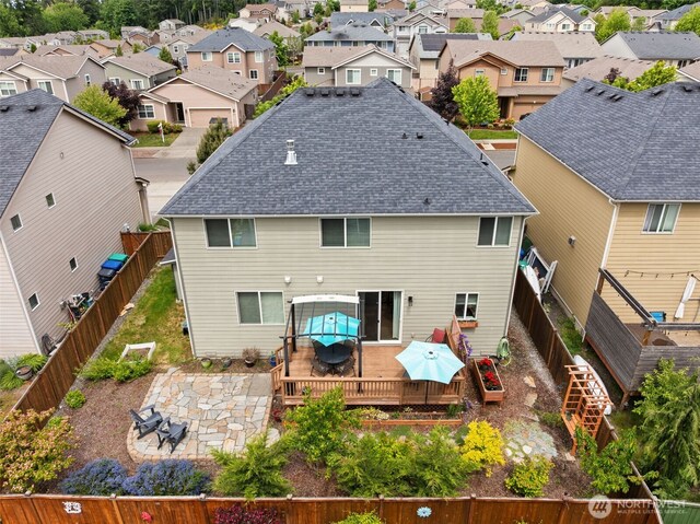 4415 Goldcrest Dr NW, Olympia, WA 98502 - back of house featuring outdoor dining space, a wooden deck, a residential view, and a fenced backyard