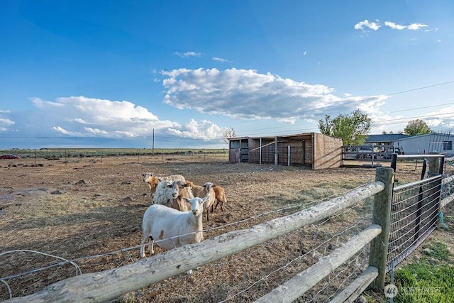 13576 NE Rd 10, Moses Lake, WA 98837 - view of yard featuring an exterior structure, a view of countryside, and an outdoor structure