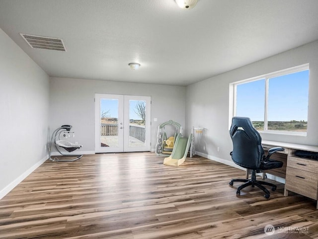 13576 NE Rd 10, Moses Lake, WA 98837 - home office featuring wood finished floors, baseboards, and french doors