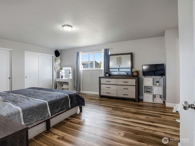 13576 NE Rd 10, Moses Lake, WA 98837 - bedroom featuring wood finished floors, baseboards, and a textured ceiling