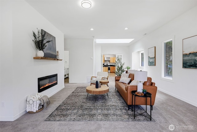 8010 Beverly Blvd Unit A, Everett, WA 98203 - carpeted living room with a glass covered fireplace, a skylight, recessed lighting, and baseboards