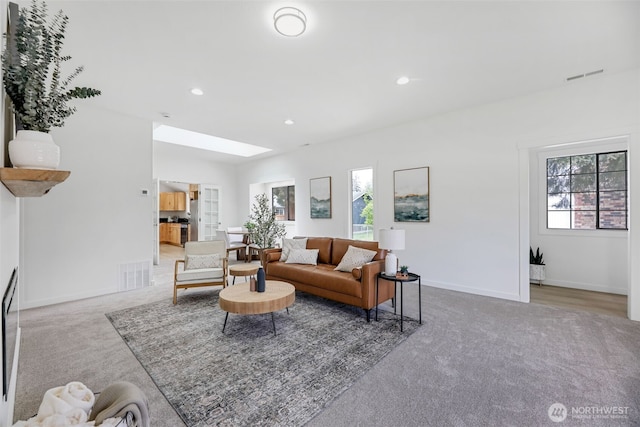 8010 Beverly Blvd Unit A, Everett, WA 98203 - carpeted living room with baseboards, recessed lighting, and a skylight