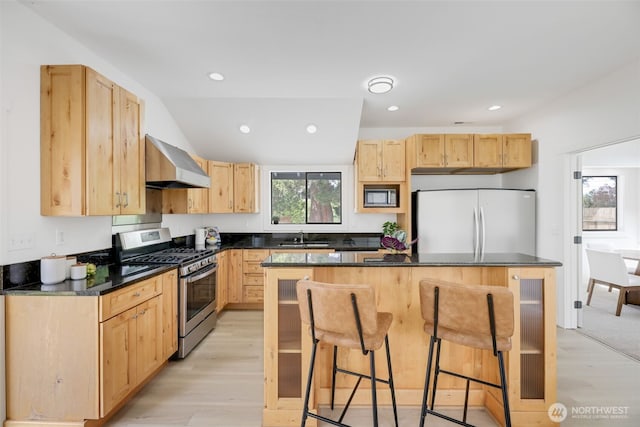 8010 Beverly Blvd Unit A, Everett, WA 98203 - kitchen with wall chimney exhaust hood, refrigerator, stainless steel range with gas stovetop, light brown cabinets, and recessed lighting
