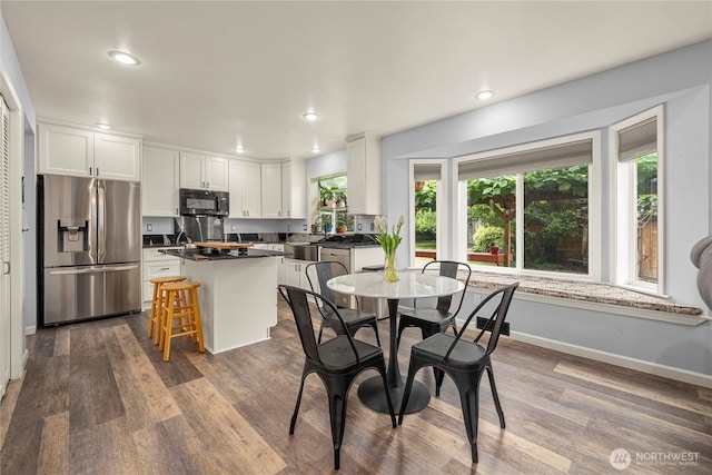 27772 213th Ct SE, Maple Valley, WA 98038 - dining area featuring dark wood-type flooring and recessed lighting