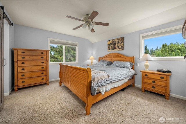 27772 213th Ct SE, Maple Valley, WA 98038 - bedroom featuring light carpet, a ceiling fan, and a barn door