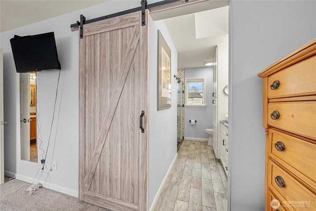 27772 213th Ct SE, Maple Valley, WA 98038 - hallway with a barn door and light wood-style flooring