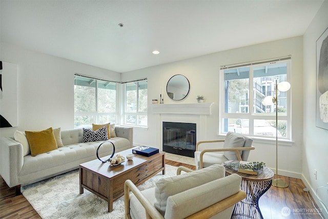 12019 NE 204th Pl Unit D303, Bothell, WA 98011 - living area featuring a fireplace with flush hearth, wood finished floors, baseboards, and recessed lighting