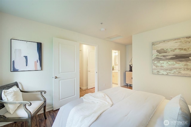 12019 NE 204th Pl Unit D303, Bothell, WA 98011 - bedroom featuring wood finished floors, baseboards, ensuite bathroom, and attic access