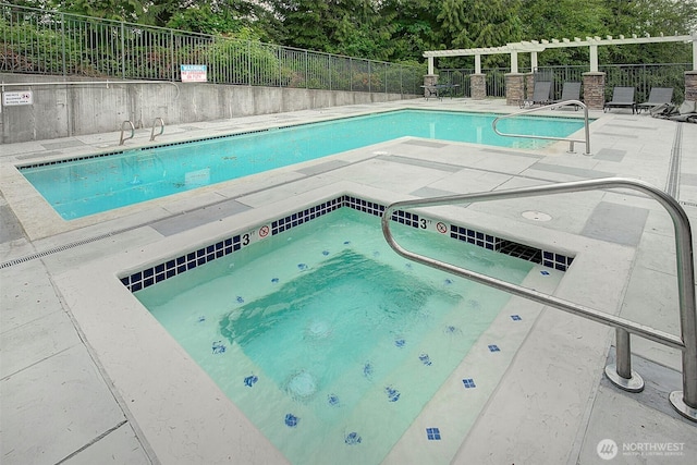12019 NE 204th Pl Unit D303, Bothell, WA 98011 - community pool with a community hot tub, a patio, and view of wooded area