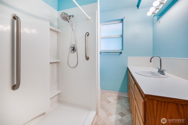 11319 86th Ave E, Puyallup, WA 98373 - bathroom featuring a walk in shower, vanity, and baseboards