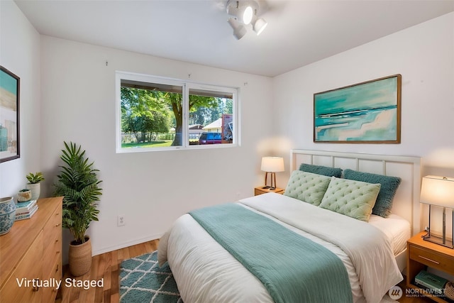 11319 86th Ave E, Puyallup, WA 98373 - bedroom featuring wood finished floors and baseboards