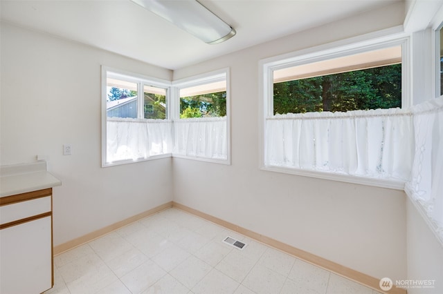 11319 86th Ave E, Puyallup, WA 98373 - unfurnished dining area featuring baseboards
