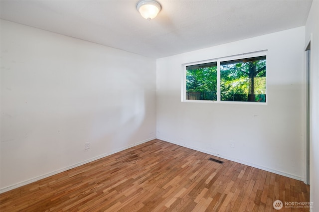11319 86th Ave E, Puyallup, WA 98373 - spare room with light wood finished floors and baseboards