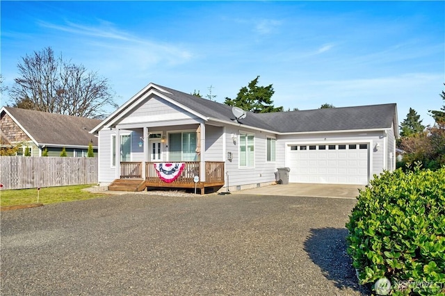 152 N Oar Loop NW, Ocean Shores, WA 98569 - view of front facade featuring a garage, driveway, and covered porch