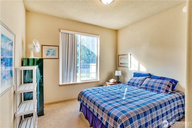 152 N Oar Loop NW, Ocean Shores, WA 98569 - bedroom featuring carpet floors, baseboards, and a textured ceiling
