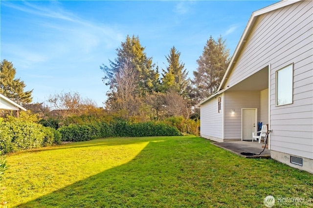 152 N Oar Loop NW, Ocean Shores, WA 98569 - view of grassy yard featuring a patio area