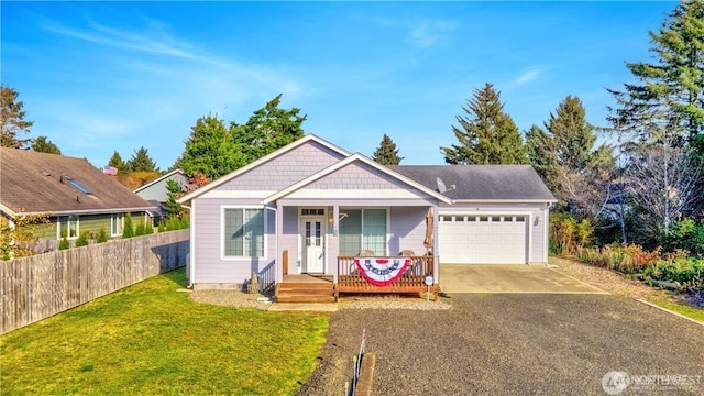 152 N Oar Loop NW, Ocean Shores, WA 98569 - view of front of home featuring an attached garage, driveway, and covered porch