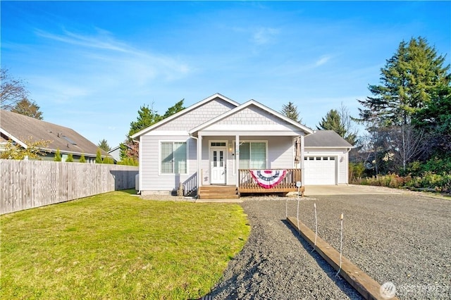 152 N Oar Loop NW, Ocean Shores, WA 98569 - view of front of property with covered porch, a garage, and gravel driveway