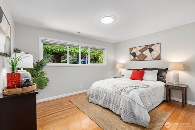 8414 34th Ave SW, Seattle, WA 98126 - bedroom featuring wood finished floors and baseboards