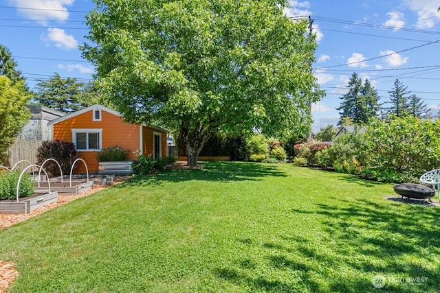8414 34th Ave SW, Seattle, WA 98126 - view of yard featuring a garden and a fire pit