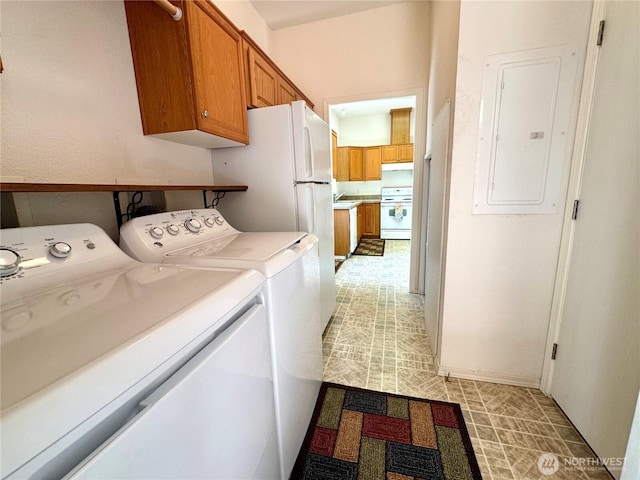 173 Steelhead Dr, Silver Creek, WA 98585 - laundry area featuring separate washer and dryer, electric panel, cabinet space, light floors, and baseboards