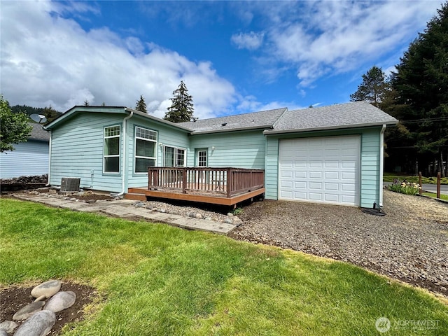 173 Steelhead Dr, Silver Creek, WA 98585 - back of house with a garage, a deck, a yard, driveway, and central AC