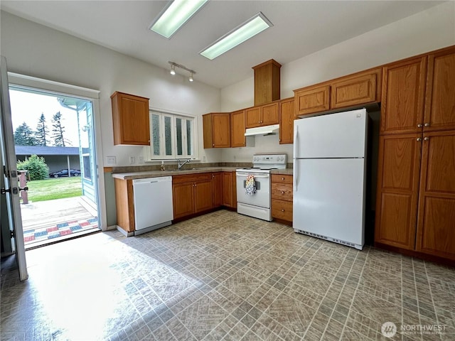 173 Steelhead Dr, Silver Creek, WA 98585 - kitchen with white appliances, under cabinet range hood, brown cabinets, a sink, and rail lighting