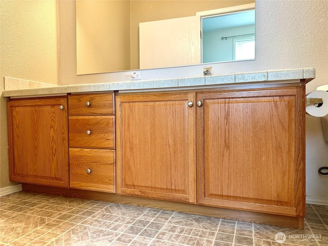 173 Steelhead Dr, Silver Creek, WA 98585 - bathroom featuring vanity, a textured wall, and baseboards