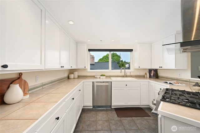3633 22nd Ave W Unit C, Seattle, WA 98199 - kitchen featuring stainless steel appliances, a sink, wall chimney range hood, white cabinets, and recessed lighting