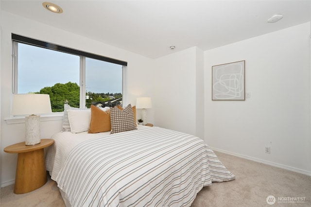 3633 22nd Ave W Unit C, Seattle, WA 98199 - bedroom featuring light carpet, baseboards, and recessed lighting