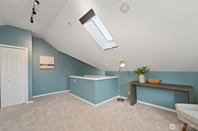 3633 22nd Ave W Unit C, Seattle, WA 98199 - bonus room featuring lofted ceiling, carpet flooring, baseboards, and a skylight
