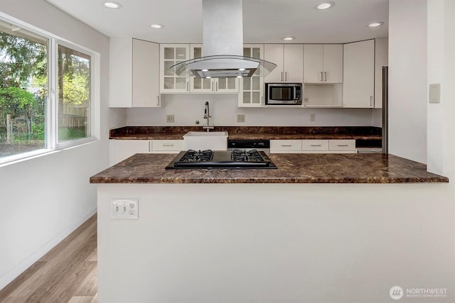 19055 SE 269th St, Covington, WA 98042 - kitchen featuring stainless steel microwave, a sink, island exhaust hood, white cabinets, and recessed lighting