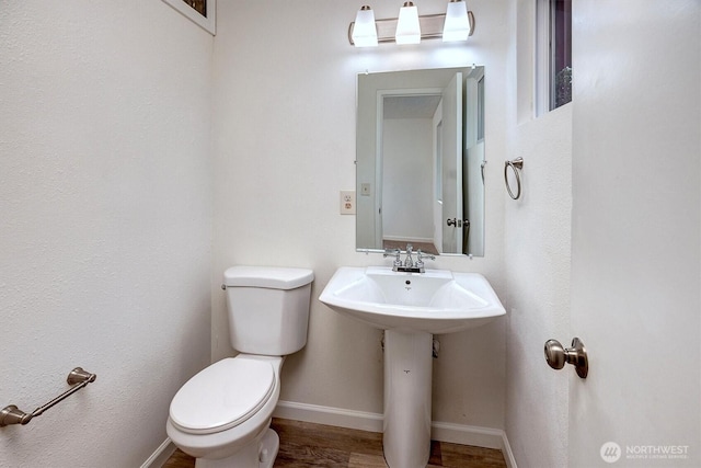 19055 SE 269th St, Covington, WA 98042 - half bathroom featuring toilet, wood finished floors, and baseboards