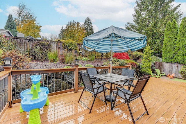 14531 86th Pl NE, Kenmore, WA 98028 - wooden terrace featuring outdoor dining space and a fenced backyard